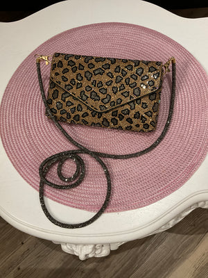 Sac bandoulière or et noir brillant